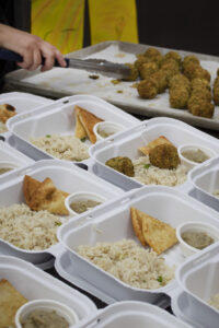 night market mediterranean falafel in take out boxes served with rice and pita ready to go