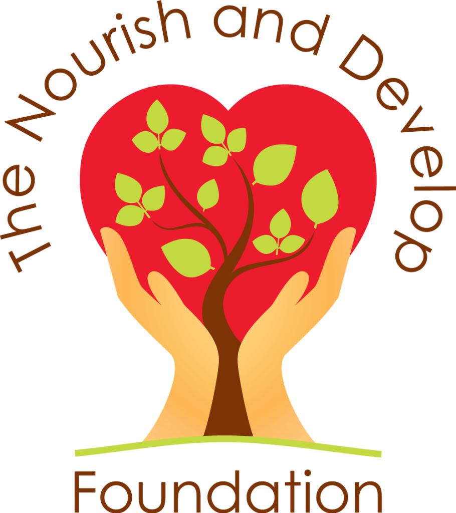 A tree on a heart held by two hands, surrounded by 'The Nourish and Develop' above and 'Foundation' below.