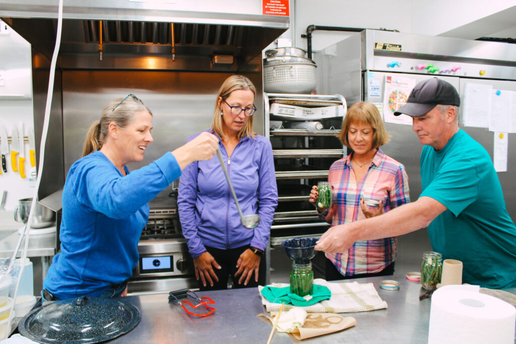 Alana Crawford leading a preserves cooking class