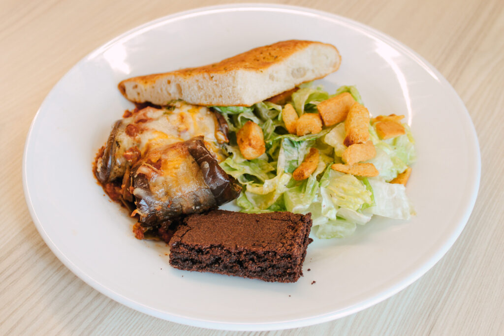 Community lunch - focaccia, caesar salad, eggplant rollatini, and brownie