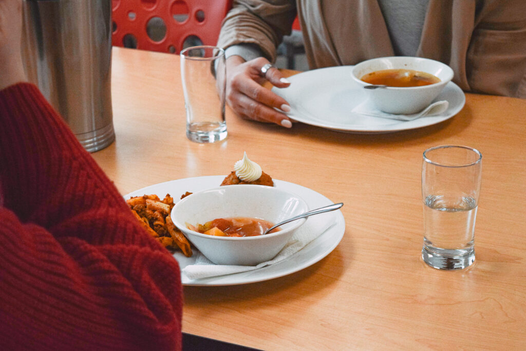 To women enjoy Community Lunch
