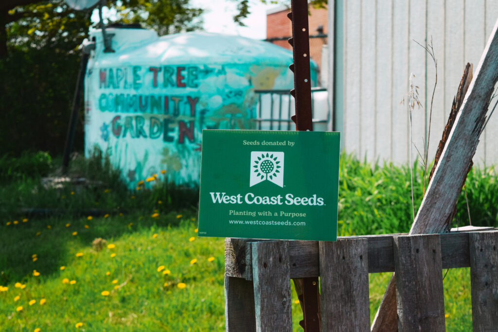 West Coast Seeds sign in Maple Tree Community Garden