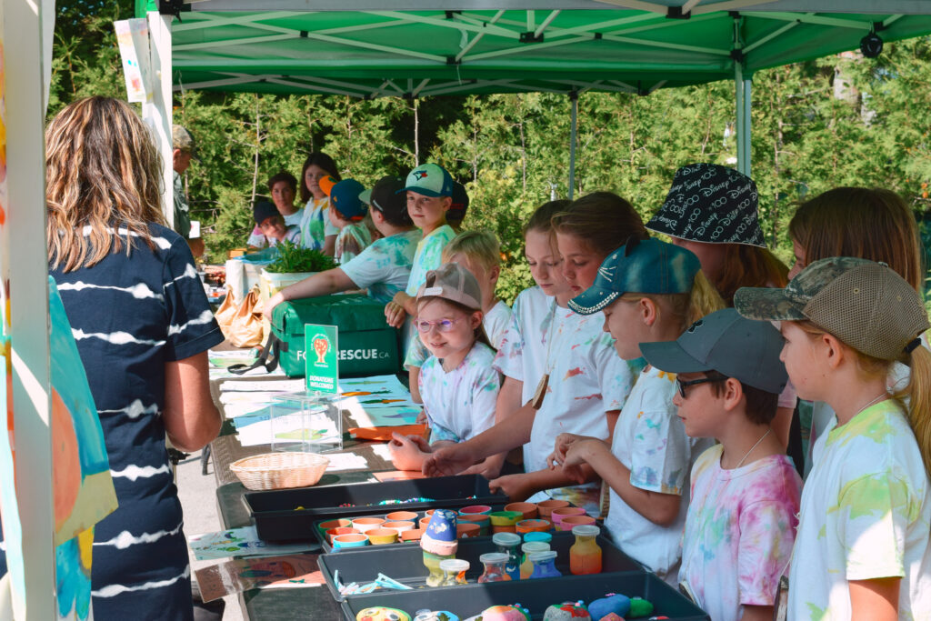 Participants of our Farmers Market Summer Kids Camp sell handmade goods to customers.