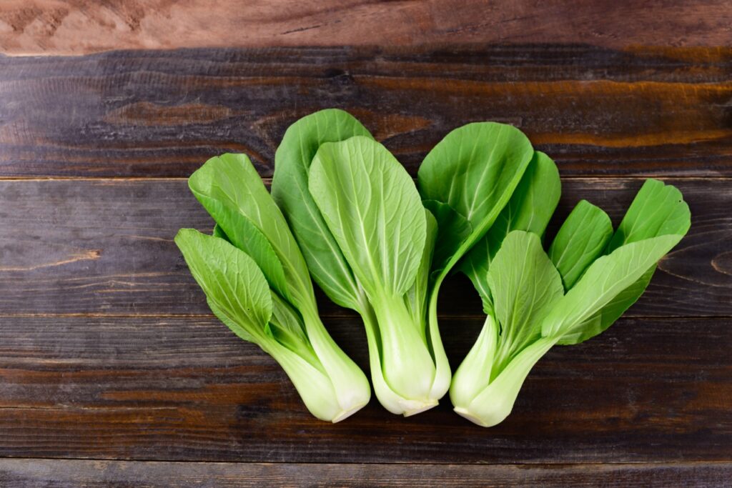 Fresh Bok Choy or Pak Choi(Chinese cabbage) on wooden background, Organic vegetables, Top view