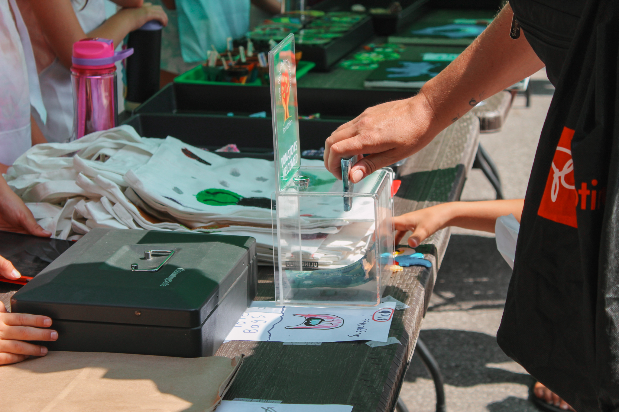 Donations being made at our Kid-Run Farmers Market Camp