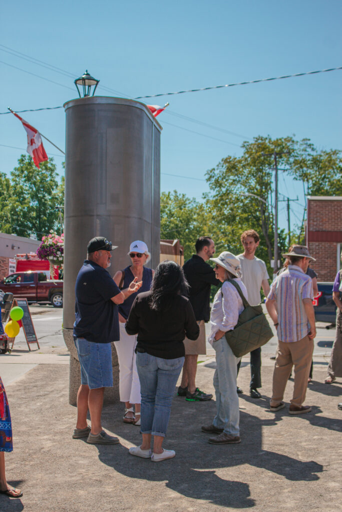 People gather around the battery